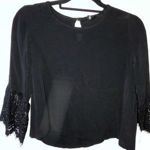 Black blouse with lace detail on sleeve